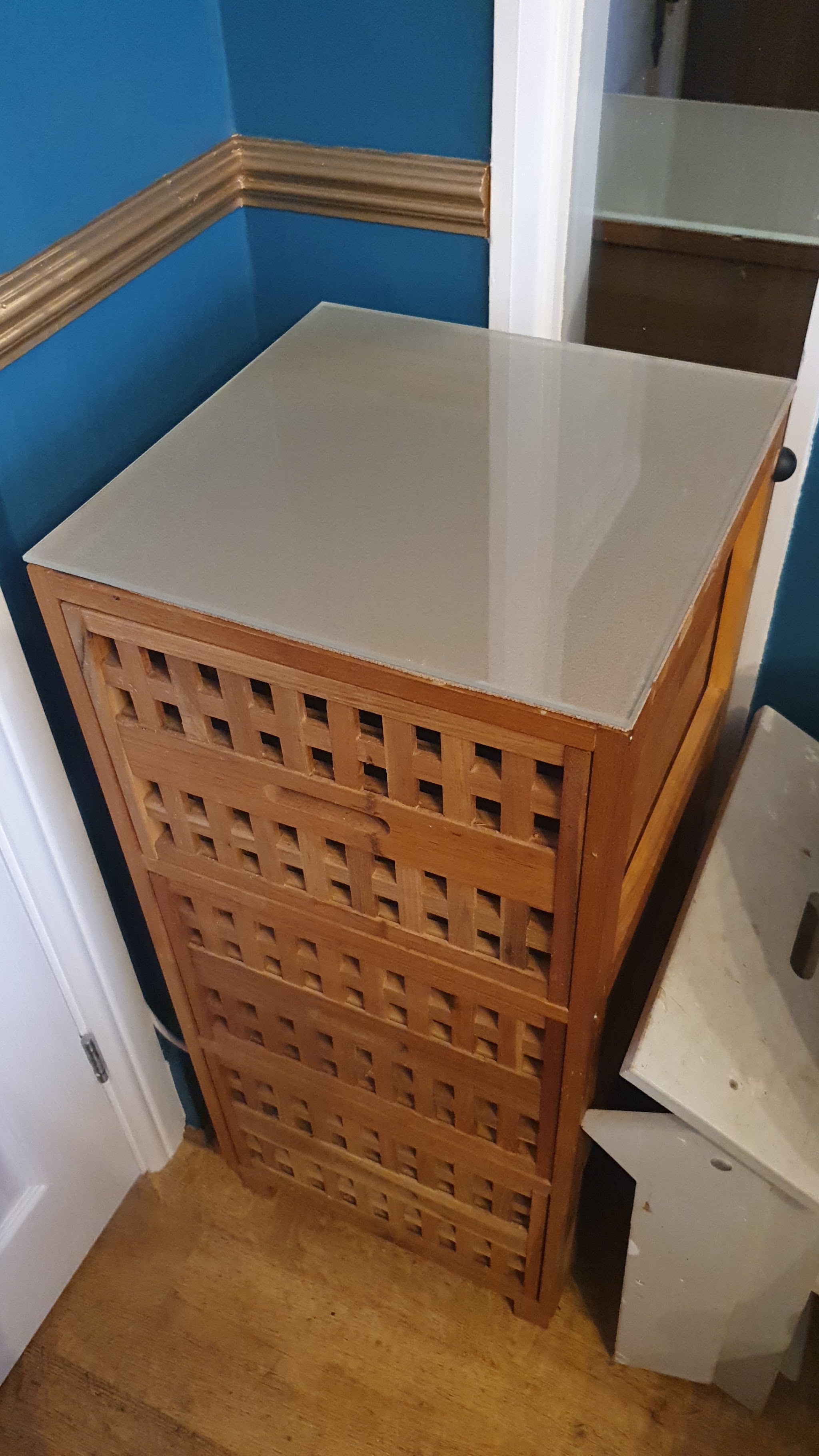 Wooden cabinet with a satin glass top
